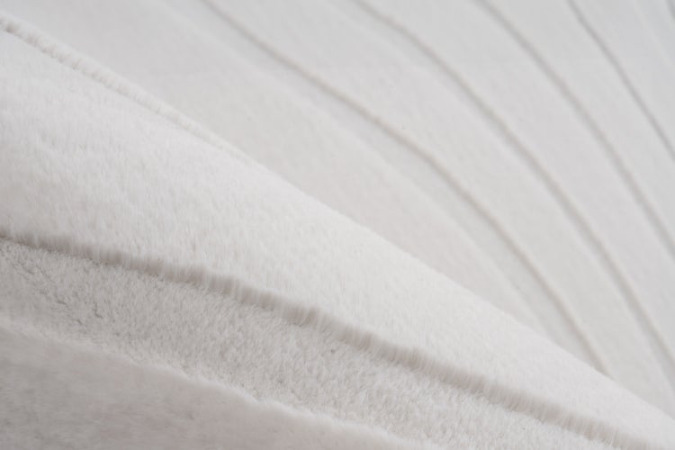 Detailaufnahme von flauschigem Textilmaterial mit feiner Oberflächenstruktur.