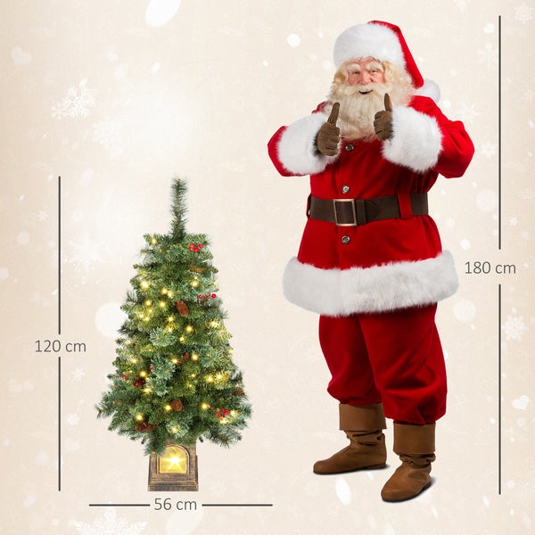 Künstlicher Weihnachtsbaum mit LED-Beleuchtung, Zapfen und Beeren, 120 Zentimeter hoch, 56 Zentimeter breit, im Vergleich zu 180 Zentimeter Figur.
