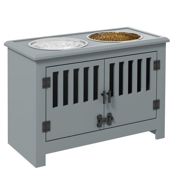 Graue Futterstation für Hunde aus Holz mit zwei Edelstahlnäpfen und integriertem Schrank mit Lamellentüren und schwarzen Beschlägen.