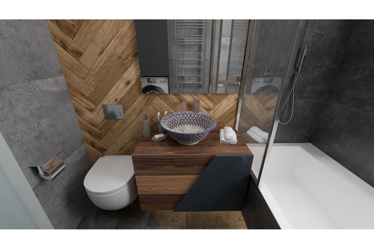 Badezimmer mit Toilette, Waschbecken, Waschtisch und Badewanne