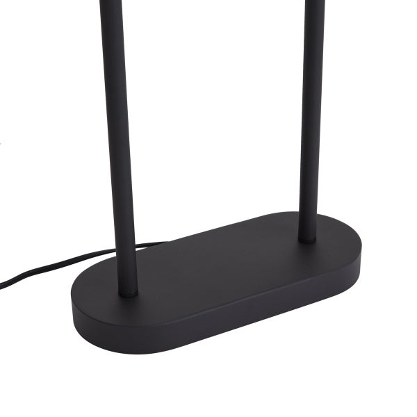 Schwarzer, ovaler Lampenfuß mit zwei vertikalen Stäben und einem Stromkabel.