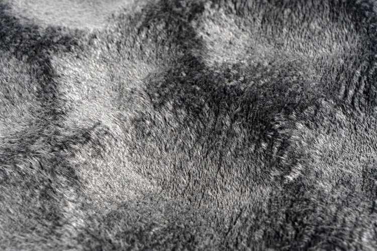 Detailaufnahme einer weichen Webpelz Oberfläche mit dichtem Flor