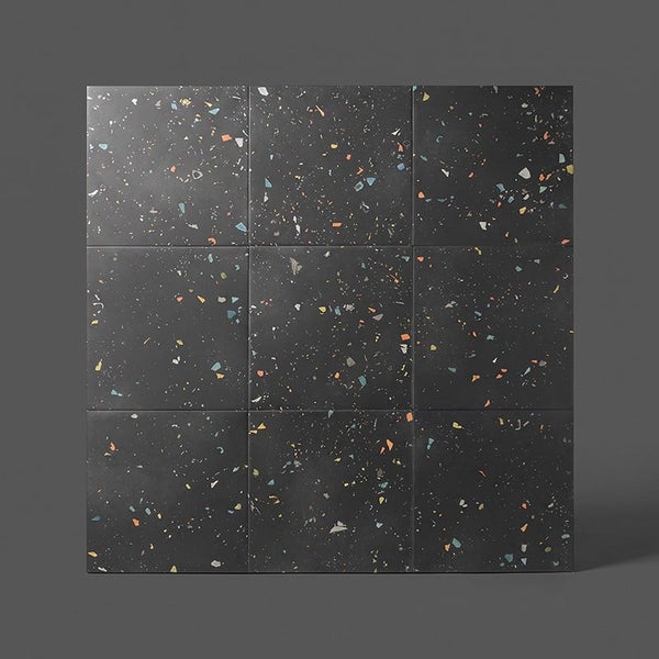 Neun quadratische Fliesen in Terrazzo Optik mit buntem Sprenkelmuster für Wand und Boden.