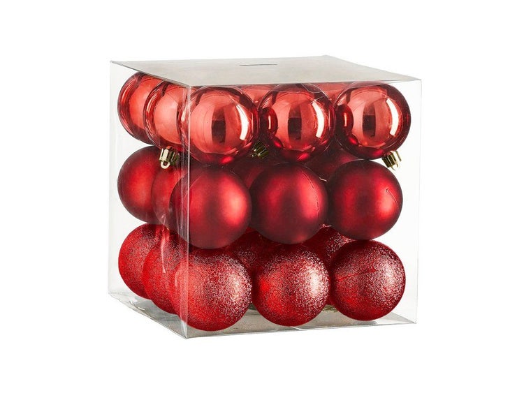 Set mit roten Weihnachtskugeln in verschiedenen Oberflächen in einer transparenten Kunststoffverpackung