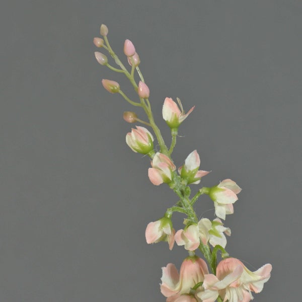 Kunstblumenstiel mit filigranen rosa-weißen Blüten und Knospen.