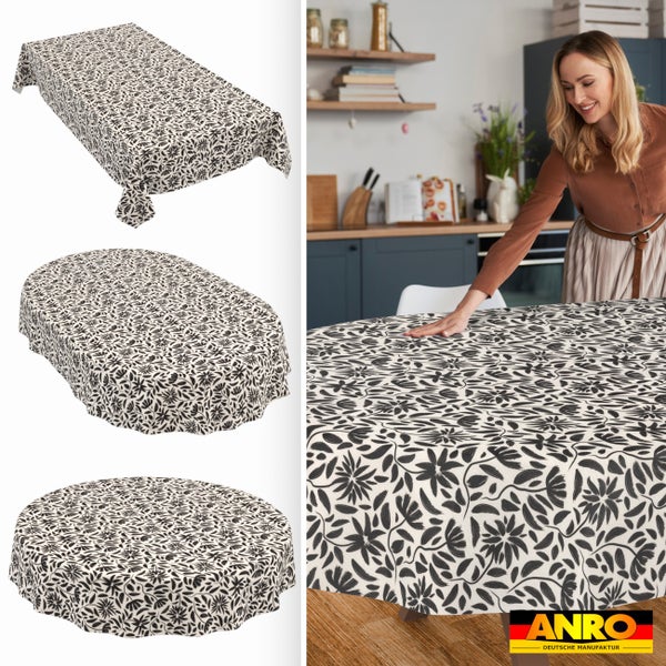 Tischdecke mit Blumenmuster in rechteckiger, ovaler und runder Form und eine Frau in einer hellen, organisierten Küche beim Eindecken, ANRO Logo.