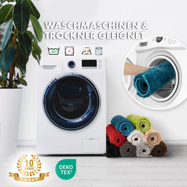 Waschmaschine mit Fußmatten und den Hinweisen waschmaschinengeeignet und trocknergeeignet, sowie den Symbolen 40 Grad, nicht bleichen, nicht bügeln und Trocknergeeignet, Karat 10 Jahre Garantie Logo und Oeko Tex Siegel