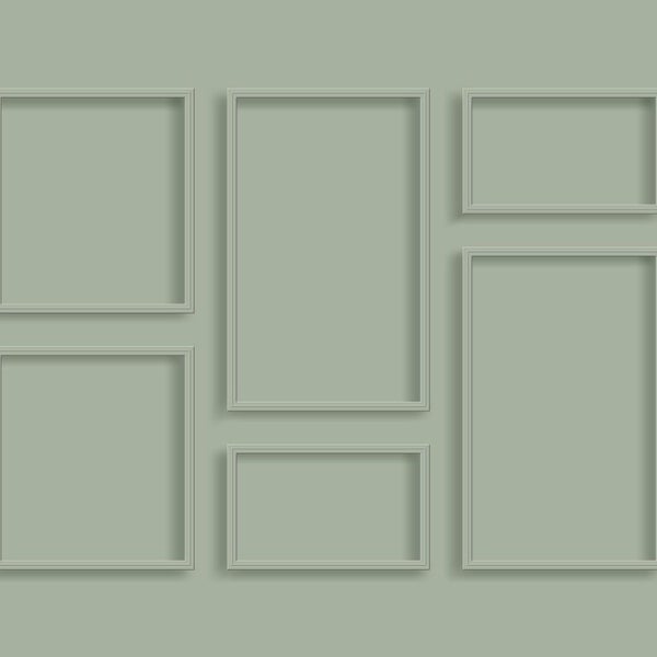 Mehrere leere Bilderrahmen verschiedener Größe an der Wand