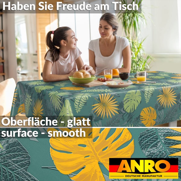 Abwaschbare Tischdecke mit tropischem Blättermuster in einem hellen Esszimmer, glatte Oberfläche, ANRO Logo.