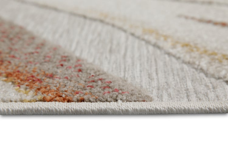 Nahaufnahme eines gewebten Teppichs in Grau, Beige und Orange mit geketteltem Rand.