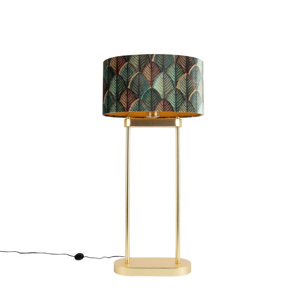 Tischlampe mit goldfarbenem Gestell und zylindrischem Lampenschirm mit Blattmuster