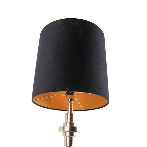 Tischleuchte mit schwarzem Schirm und goldfarbenem Sockel