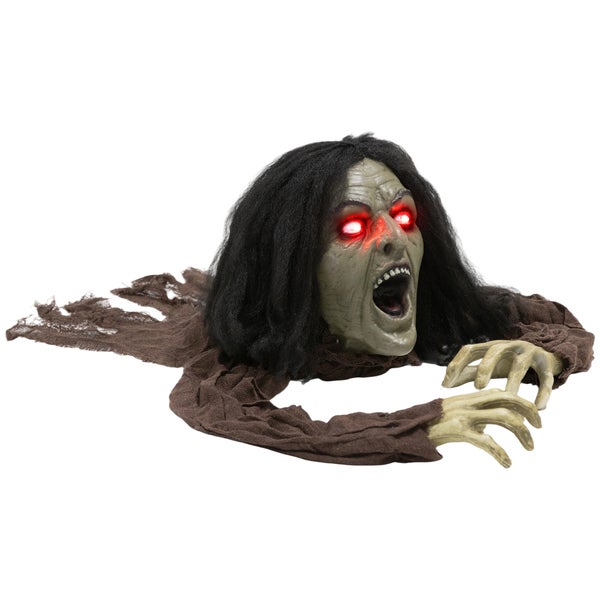 Kriechender Zombie als Halloween Dekoration mit leuchtenden Augen