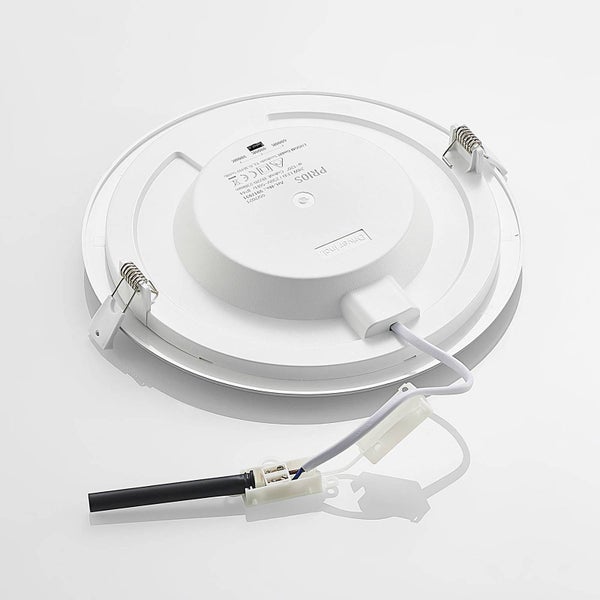 Rückseite eines runden Einbaupanels mit zwei Montagefedern, Anschlusskabel und Wahlschalter für die Farbtemperatur.