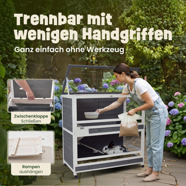 Zweistöckiger Kleintierstall aus Holz im Garten, trennbar durch Zwischenklappe und aushängbare Rampe, ohne Werkzeug bedienbar.