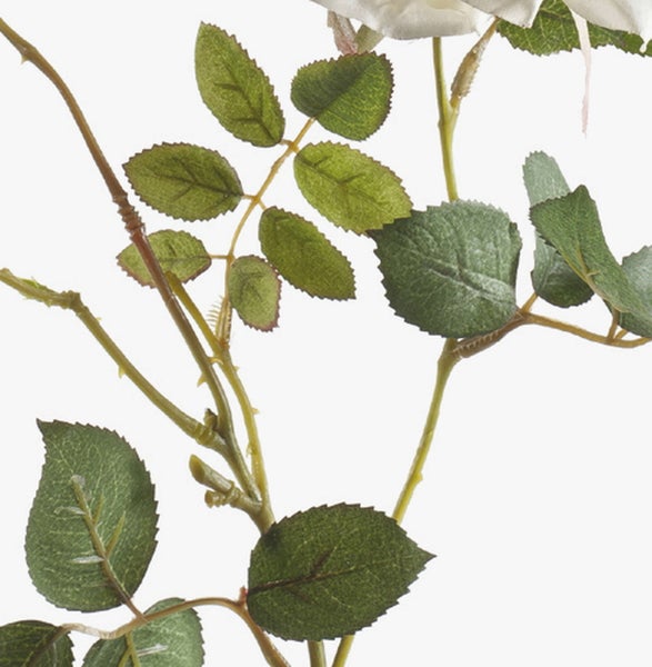 Detailansicht einer Kunstpflanze mit einem grünen Blatt, Stiel und violetten Blüten.