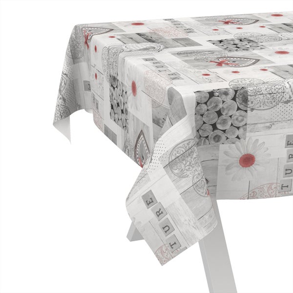 Tischdecke mit Holzoptik, Blumen- und Herzmotiven auf einem Tisch