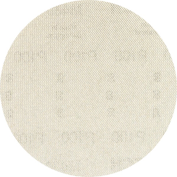 Eine Person benutzt ein Bosch Multifunktionswerkzeug zum Schneiden eines Lochs in einen Schrank.