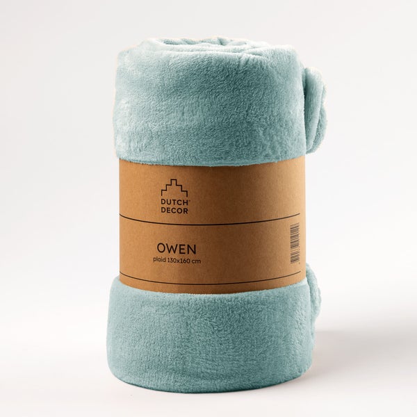 Gerollte Kuscheldecke mit Papierbanderole