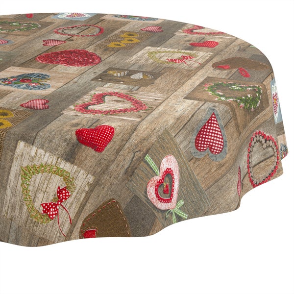 Runde Tischdecke mit Holzoptik und verschiedenen Herz- und Kranzmotiven im Landhausstil.