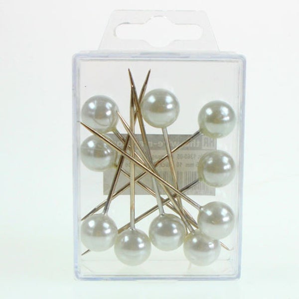 Stecknadeln mit Perlenkopf im durchsichtigen Behälter