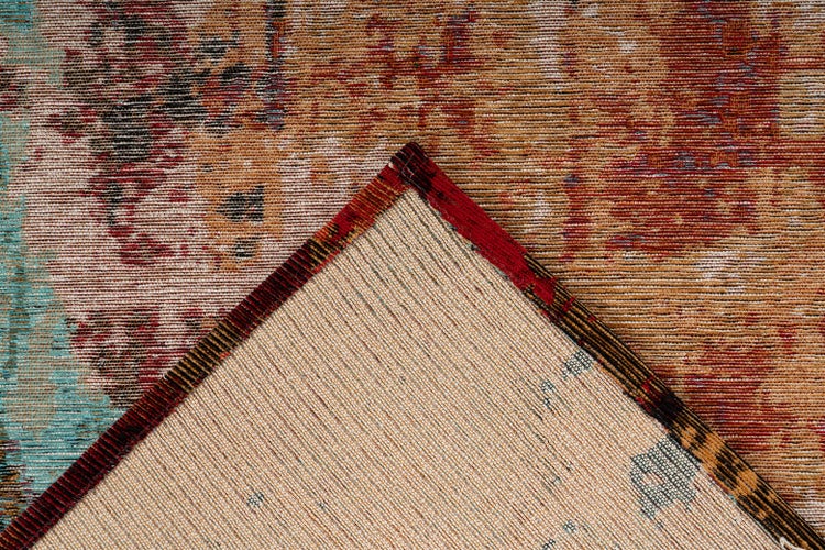 Gewebter Teppich mit abstraktem Vintage-Muster in Nahaufnahme, Ecke umgeschlagen zur Ansicht der Rückseite.