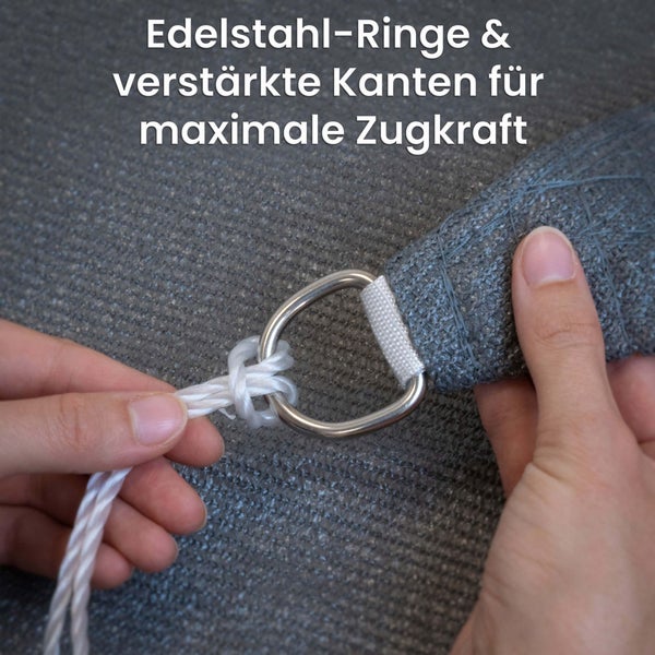 Sonnensegel mit Edelstahl-Ring und verstärktem Rand für maximale Zugkraft beim Befestigen des Seils.
