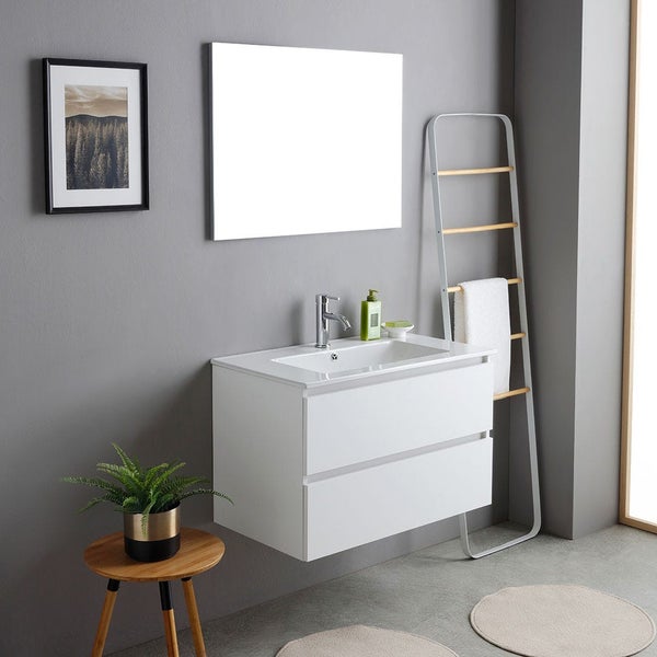 Moderner, wandhängender Waschbeckenunterschrank mit zwei Schubladen und weißem Waschtisch in einem minimalistischen Badezimmer.