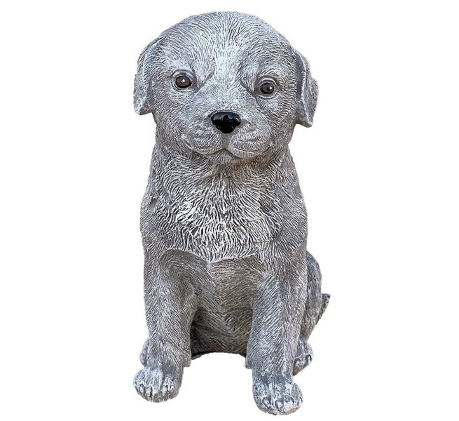 Gartenfigur in Form eines sitzenden Welpen aus Steinguss für die Gartendekoration.