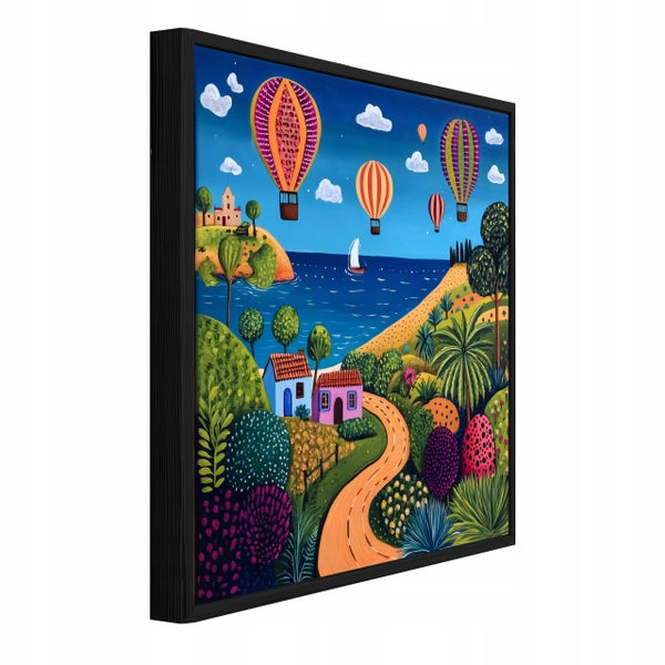 Wandbild mit Motiv von Heißluftballons über einer Küstenlandschaft in einem schwarzen Rahmen.