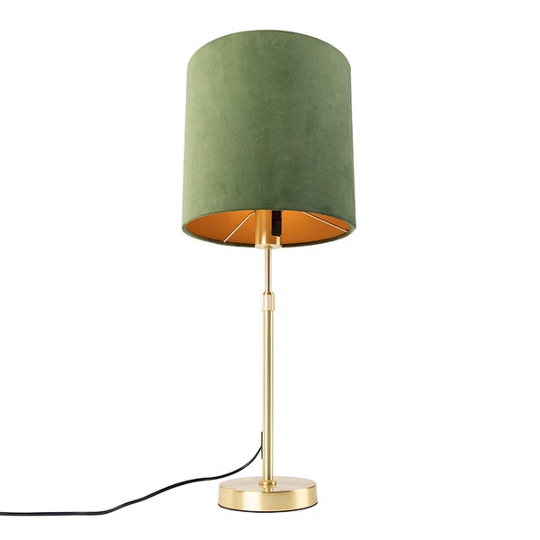 Tischleuchte mit grünem Samtschirm und goldfarbenem Metallgestell.