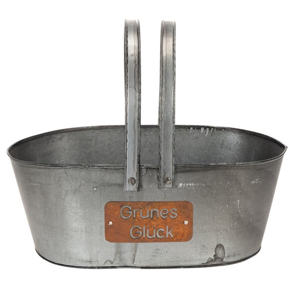 Ovaler Pflanzkorb aus Metall mit hohen Henkeln und einem Schild mit der Aufschrift Grünes Glück.