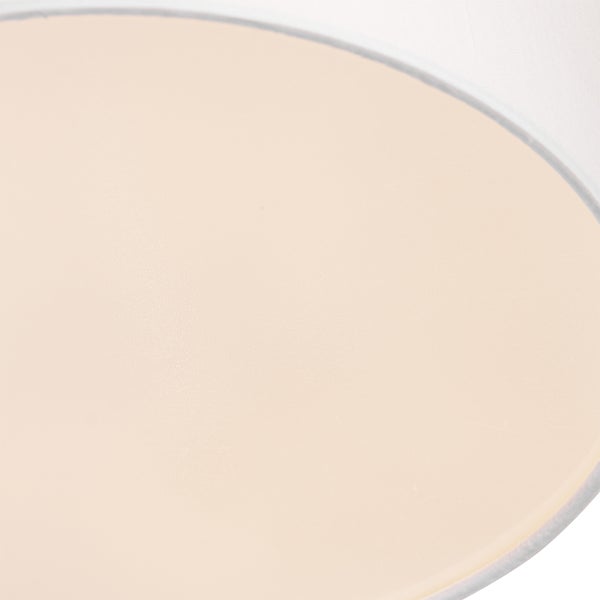 Nahaufnahme eines runden Diffusors für eine Leuchte mit Stoffrand.