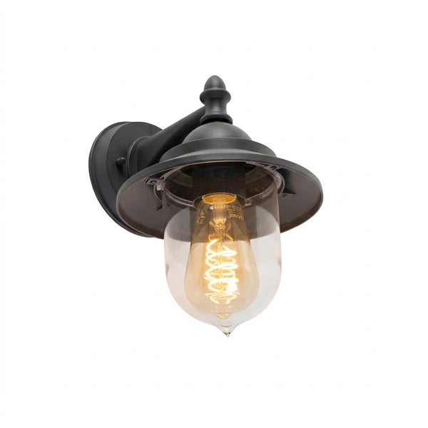 Außenwandleuchte mit klarem Glasschirm und sichtbarem Leuchtmittel im Vintage-Stil.