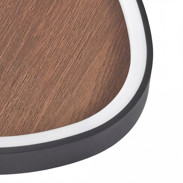 Nahaufnahme einer LED-Leuchte mit Holzoptik, weißem Leuchtring und schwarzem Rahmen.