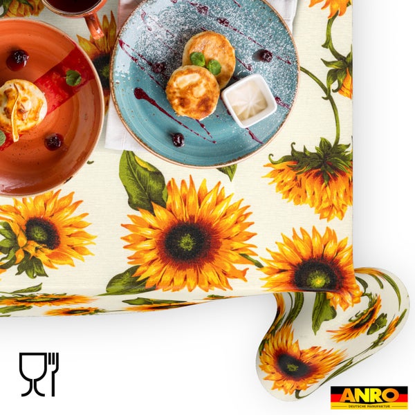 Abwaschbare Tischdecke mit Sonnenblumen-Muster und ANRO Logo, Symbol für Lebensmittelechtheit.