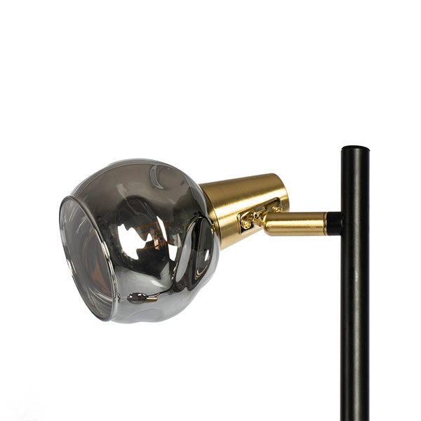 Detailaufnahme einer Leuchte mit Glaslampenschirm