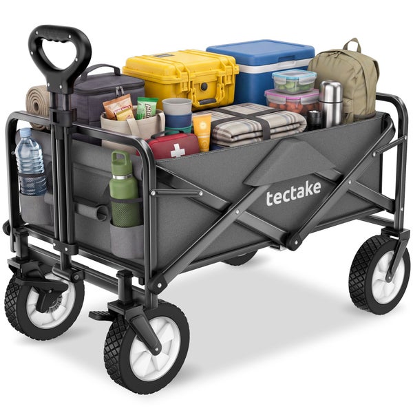 Ein faltbarer Bollerwagen von tectake mit Outdoor Ausrüstung beladen, inklusive Getränken, einer Kühlbox, einer Decke und einer Erste Hilfe Box.