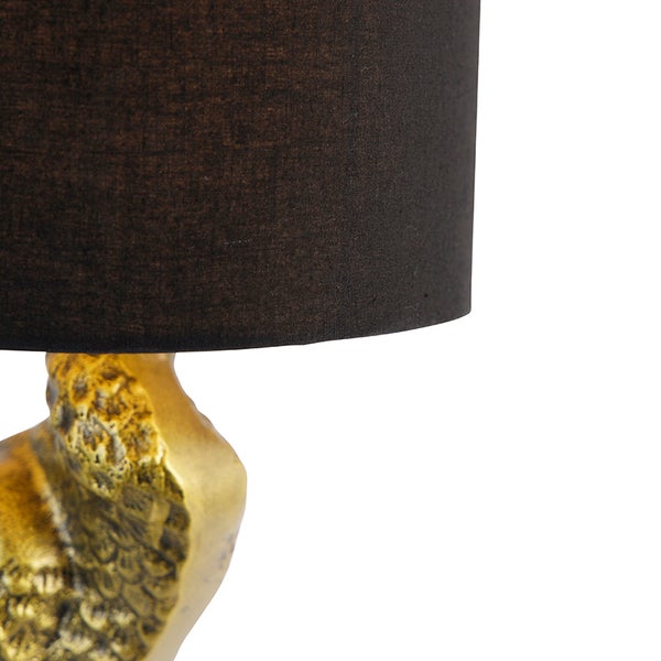 Tischleuchte mit Stoffschirm und dekorativem Fuß