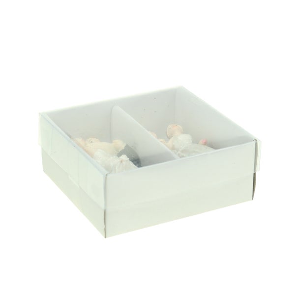 Dekorative Figuren in einer weißen Schachtel