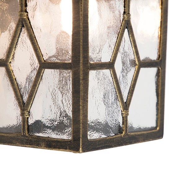 Nahaufnahme einer Laterne mit Metallrahmen im Rautendesign und strukturierten Glas-Einsätzen.