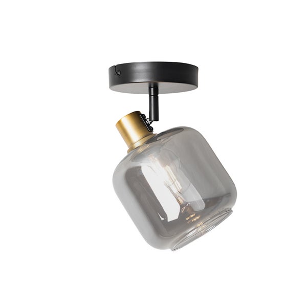 Verstellbarer Deckenstrahler aus schwarzem Metall und Messing mit rauchfarbenem Glasschirm.