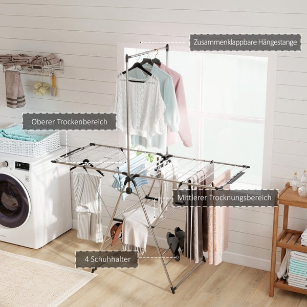 Silberner Wäscheständer in heller Waschküche mit klappbarer Hängestange, oberem und mittlerem Trockenbereich sowie 4 Schuhhaltern.