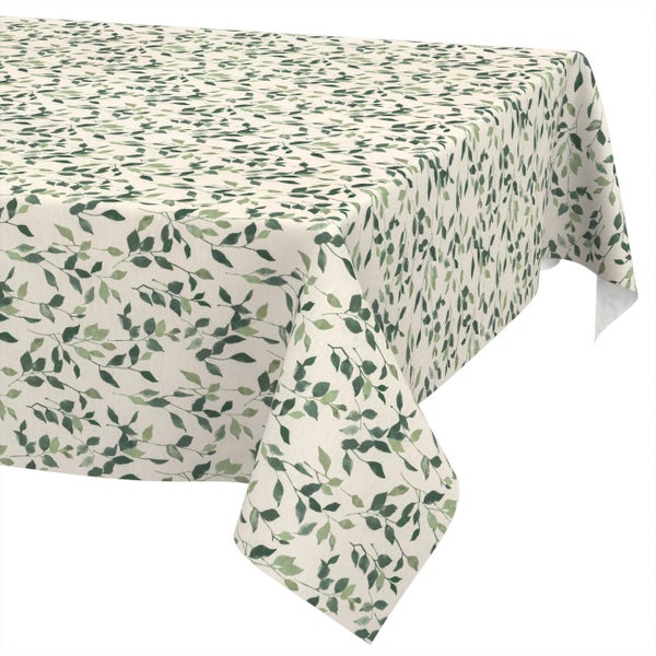 Eckige Tischdecke mit einem Muster aus grünen Blättern.