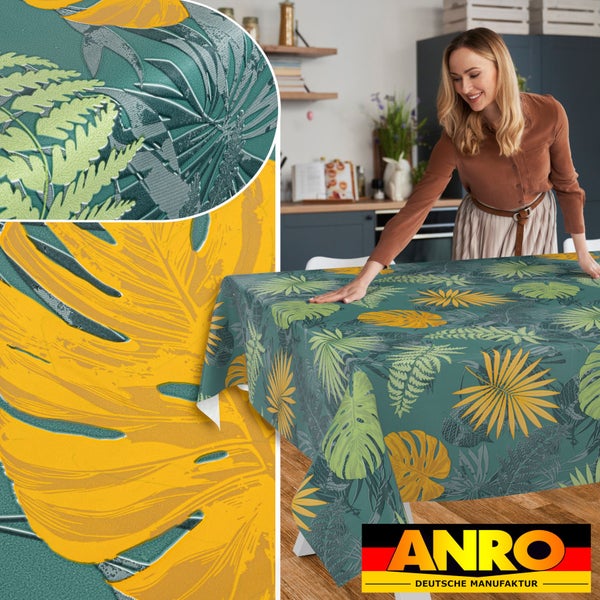 Abwaschbare Wachstuch Tischdecke mit tropischem Blättermuster in einer Küche, ANRO Deutsche Manufaktur Logo.