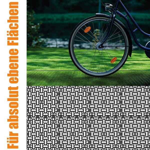 Detailaufnahme eines Rasengitters mit Fahrrad im Hintergrund