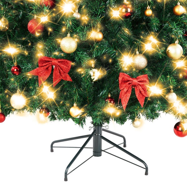 Geschmückter Weihnachtsbaum mit Christbaumkugeln, Schleifen und Beleuchtung auf einem Baumständer