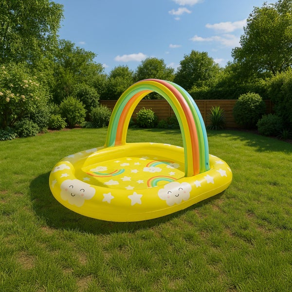 Aufblasbares Planschbecken für Kinder mit integriertem Regenbogen Sonnenschutz auf einer Rasenfläche