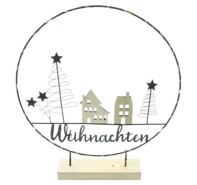 Weihnachtsdekoration mit Häusern, Bäumen, Sternen und dem Schriftzug Weihnachten