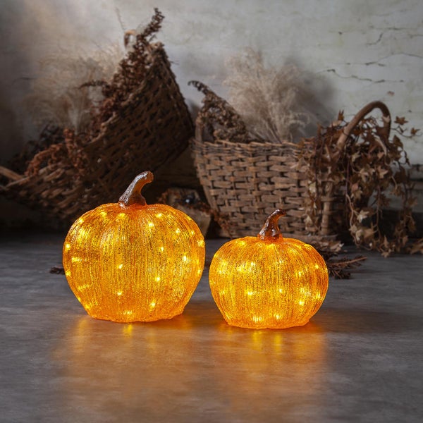 Zwei Kürbisse aus Acryl mit LED-Beleuchtung als Dekoration für Halloween